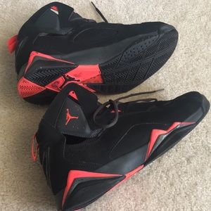 black and neon orange jordans